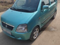 Photo of the vehicle Suzuki Wagon R+