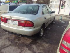 Сүрөт унаа Mazda 323