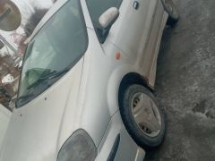 Фото авто Nissan Almera Tino