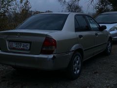 Сүрөт унаа Mazda 323