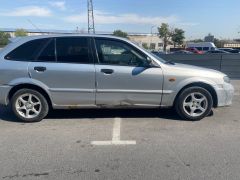 Сүрөт унаа Mazda 323