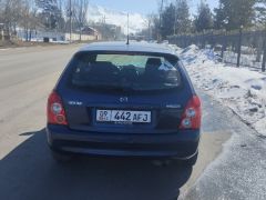 Сүрөт унаа Mazda 323