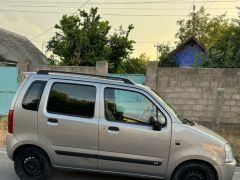 Photo of the vehicle Suzuki Wagon R+