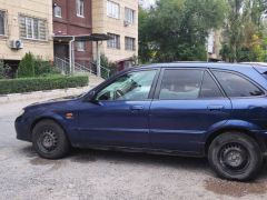 Photo of the vehicle Mazda 323