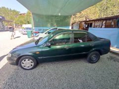 Сүрөт унаа Mazda 323