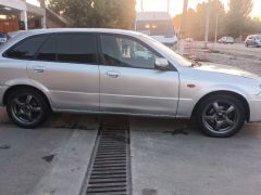 Photo of the vehicle Mazda 323