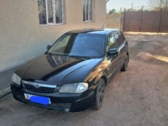 Сүрөт унаа Mazda 323