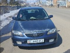 Сүрөт унаа Mazda 323