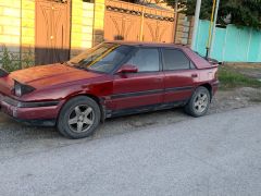 Photo of the vehicle Mazda 323