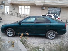 Сүрөт унаа Mitsubishi Carisma