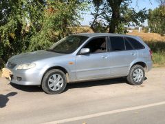 Сүрөт унаа Mazda 323