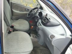 Фото авто Nissan Almera Tino