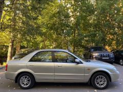 Сүрөт унаа Mazda 323