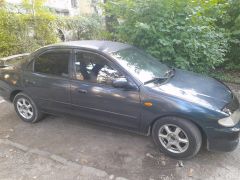 Photo of the vehicle Mazda 323