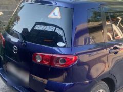 Photo of the vehicle Mazda Demio