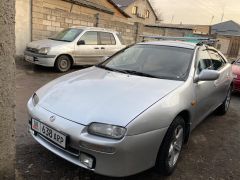 Сүрөт унаа Mazda 323