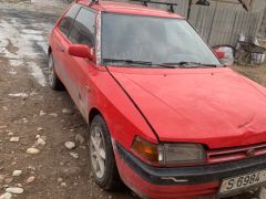 Сүрөт унаа Mazda 323