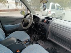 Photo of the vehicle Suzuki Wagon R+