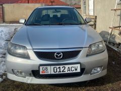 Фото авто Mazda 323