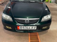 Сүрөт унаа Mazda 323