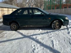 Сүрөт унаа Mazda 323