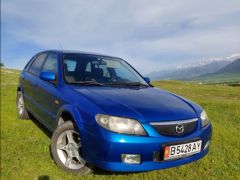 Сүрөт унаа Mazda 323