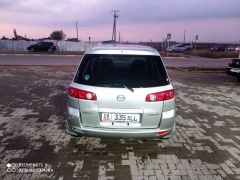 Photo of the vehicle Mazda Demio