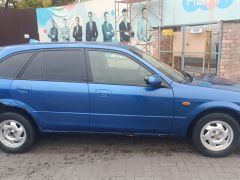 Сүрөт унаа Mazda 323