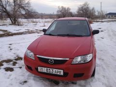 Фото авто Mazda 323