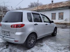 Фото авто Mazda Demio