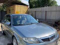 Сүрөт унаа Mazda 323