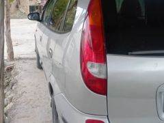 Фото авто Nissan Almera Tino