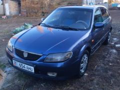 Сүрөт унаа Mazda 323