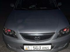 Сүрөт унаа Mazda 323