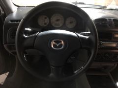 Сүрөт унаа Mazda 323