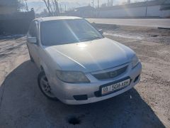 Сүрөт унаа Mazda 323