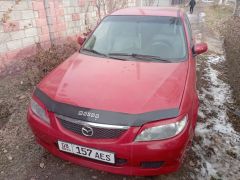 Photo of the vehicle Mazda 323