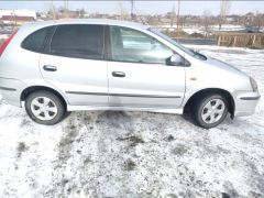 Photo of the vehicle Nissan Almera Tino