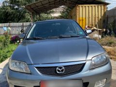 Сүрөт унаа Mazda 323