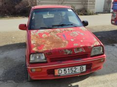 Photo of the vehicle Daihatsu Cuore