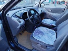 Сүрөт унаа Nissan Almera Tino