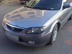 Фото авто Mazda 323