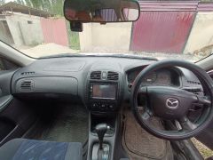 Сүрөт унаа Mazda 323