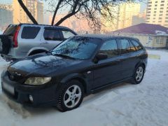 Сүрөт унаа Mazda 323