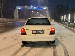 Фото авто Mazda Familia