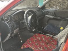 Сүрөт унаа Mazda 323