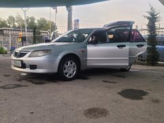 Сүрөт унаа Mazda 323