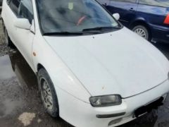 Сүрөт унаа Mazda 323