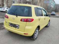 Photo of the vehicle Mazda Demio