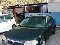 Сүрөт унаа Mazda 323